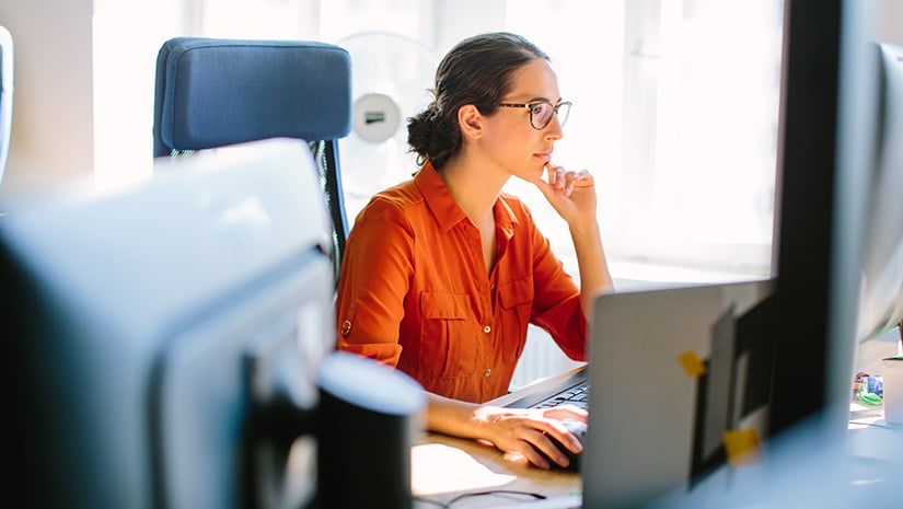 Business woman working at her desk