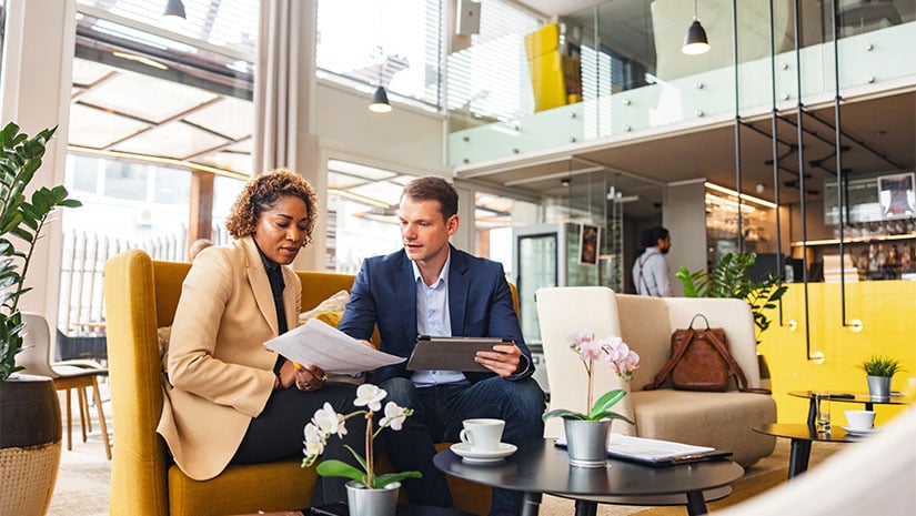 Businesswoman sitting at a cafe with her consultant