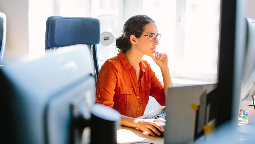 Business woman working at her desk