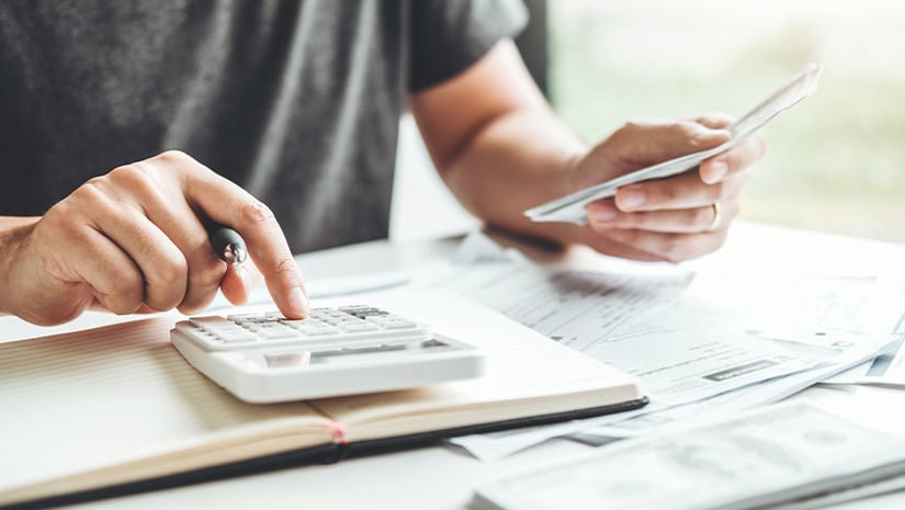 Man using calculator Accounting Calculating Cost Economic bills