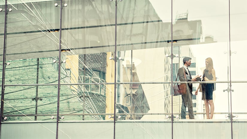 Two business people on elevated walkway
