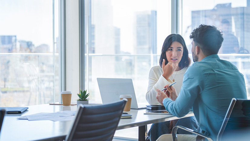 Business woman and man meeting and talking