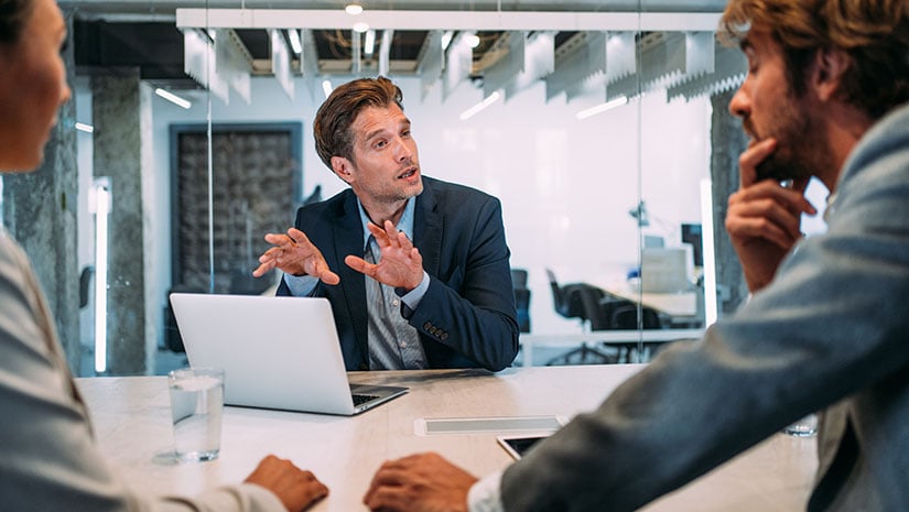 Group of business persons talking in the office
