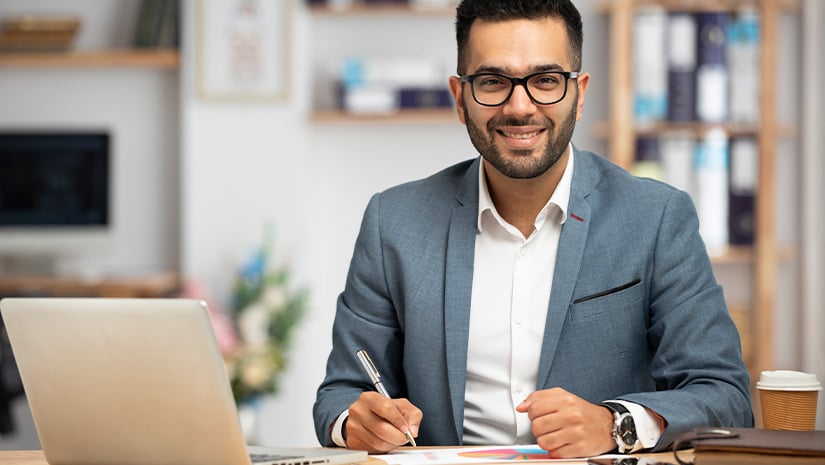 Portrait of a handsome young businessman working in office