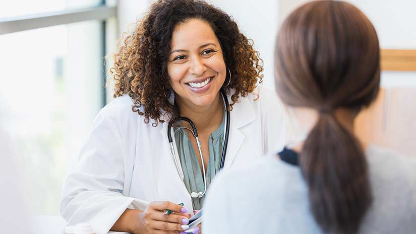 Caring doctor listens to patient